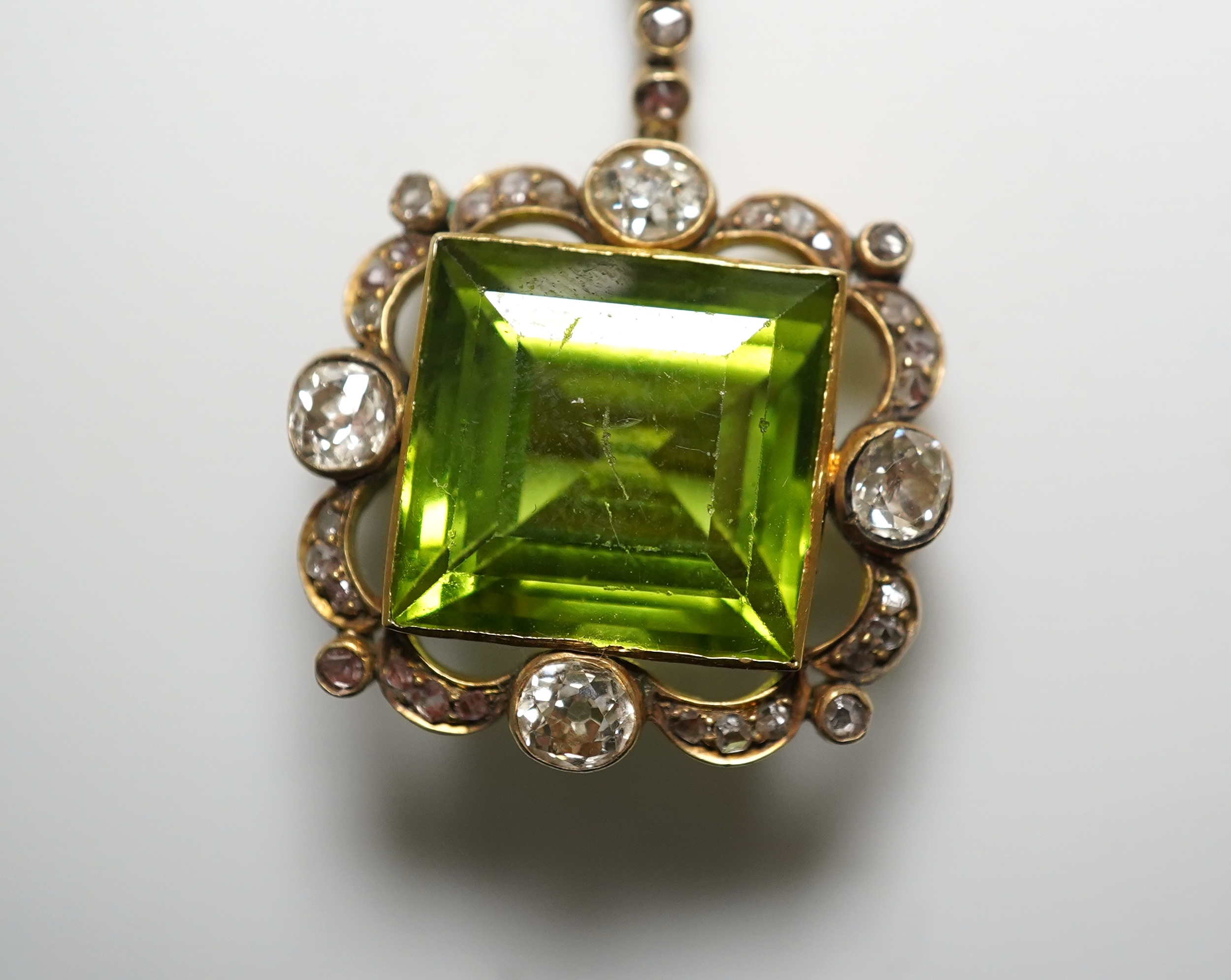 A peridot and diamond brooch, circa 1900